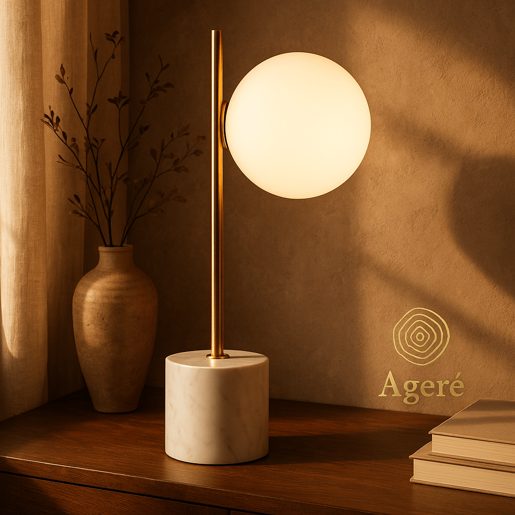 The Moon Lamp - Ageré Mood - lit shot of The Moon Lamp on a wooden desk beside minimalist ceramic decor