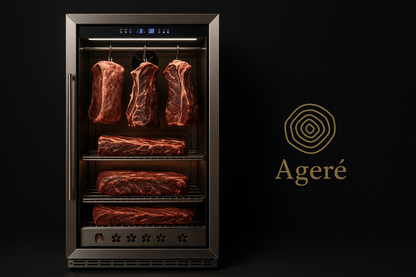 High-end dry aging fridge with multiple racks of premium beef cuts – branded with Ageré logo