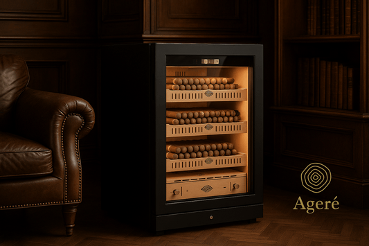 The Collector’s Edition by Ageré – compact cigar humidor in a refined wood-paneled room with warm light