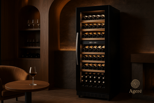 The Grand Reserve wine fridge by Ageré – premium wine cooler in a warm-toned tasting room with open door
