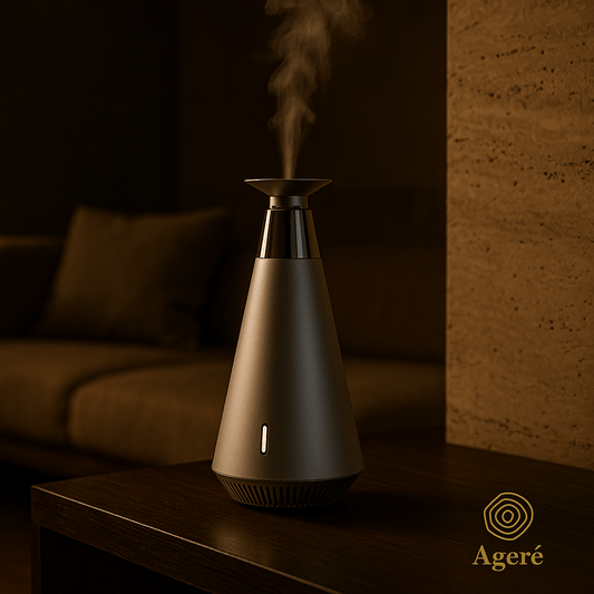 The Silent Bloom - AgeréThe Silent Bloom aroma diffuser releasing mist in a warm, modern living room — evening mood