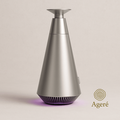 The Silent Bloom - AgeréThe Silent Bloom diffuser — brushed silver finish, conical silhouette, minimalist backdrop